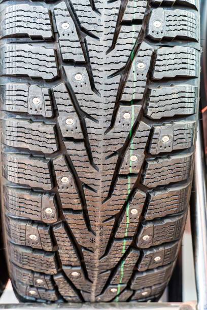 istock Close-Up of Spiked Winter Tire Tread 2167882874