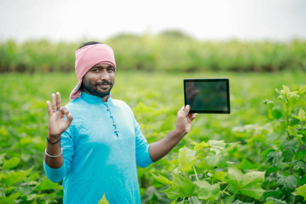 istock happy young Indian farmer using smart phone 2167883258