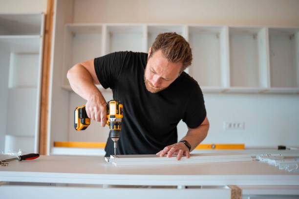 istock Focused Mid Adult Man Assembling Kitchen Cabinetry 2167884001