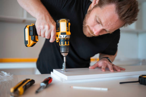 istock Focused Mid Adult Man Installing Kitchen Cabinets 2167884027