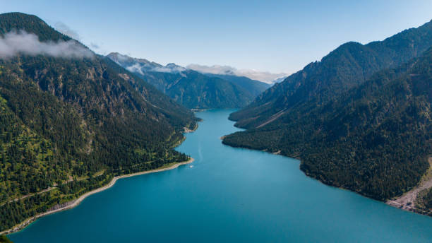 istock Serene reflection at Plansee Lake in Austria during a calm summer day 2167885763