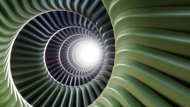 istock A spiralling tunnel of green and metallic rectangular plates with a glow at the end. 2167886551