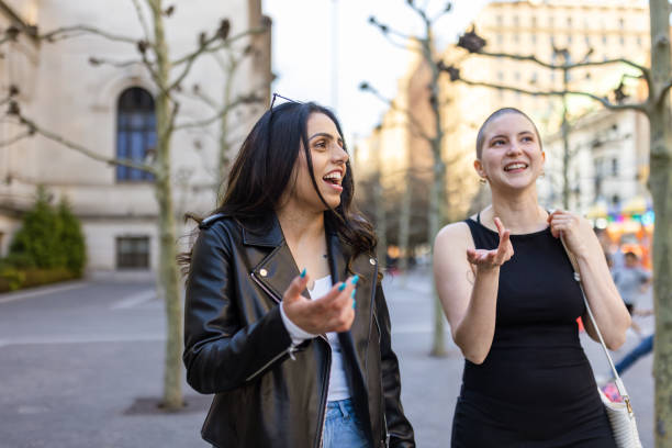 istock Two Young Women Enjoying a Lively Conversation on a Spring Afternoon 2167888771