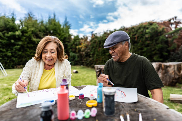 Senior friends doing recreational painting activity