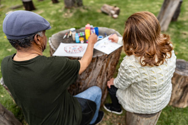 istock Senior friends doing recreational painting activity 2167891731