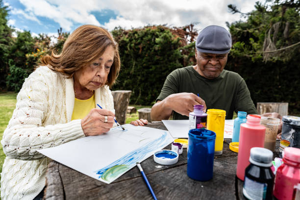 istock Senior friends doing recreational painting activity 2167891790