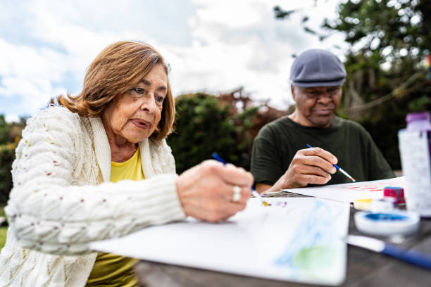 istock Senior woman doing recreational painting activity 2167891792