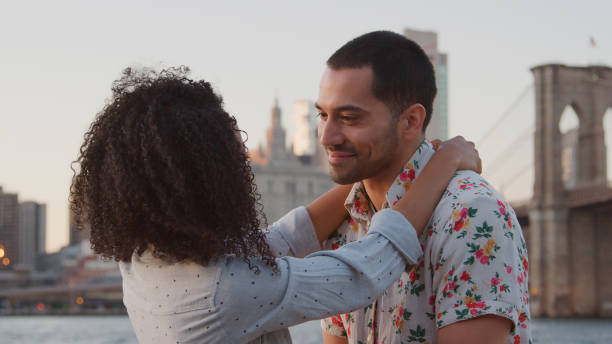 istock Romantic Young Couple On Vacation Hugging With Manhattan Skyline In Background 2167892737