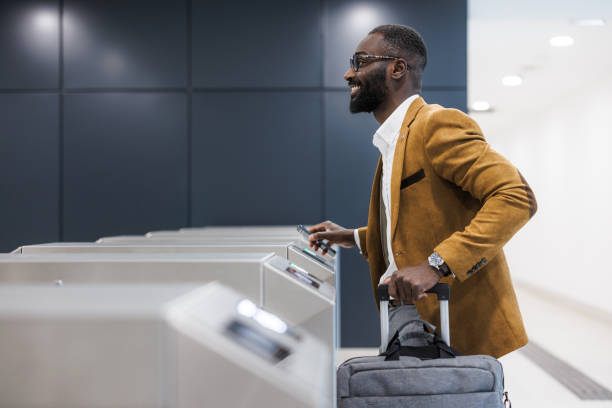 istock Businessman using smart phone for subway access at station turnstile 2167894357