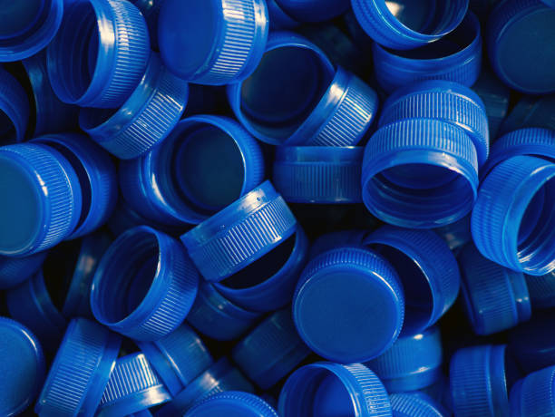 istock Top view blue plastic bottle caps.Recycling collection and production processing plastic bottle caps background ,Industrial production of bottle caps made of blue high-density polyethylene. 2167895163