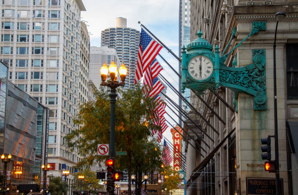 Iconic Street Clock at Marshall Fields now Macys historical building at the Loop, Downtown Chicago, IL, USA