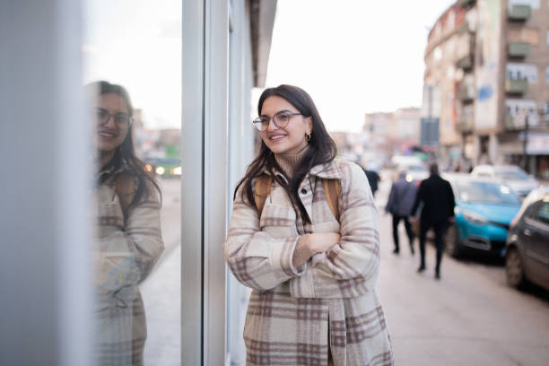 istock Young woman walking in a city 2167901322
