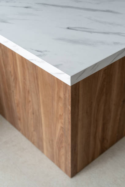 istock Modern wooden table with marble top in a minimalistic interior setting 2167902348