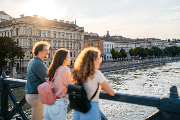 istock Three Friends Looking At View From The Chain Bridge In Budapest In Hungary 2167903176