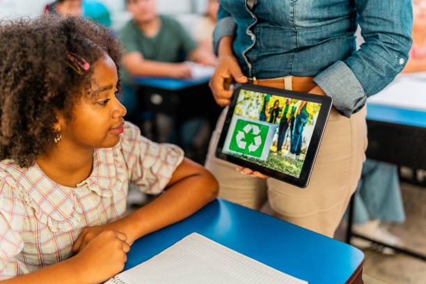 istock Child girl looking digital tablet during class at school 2167903446