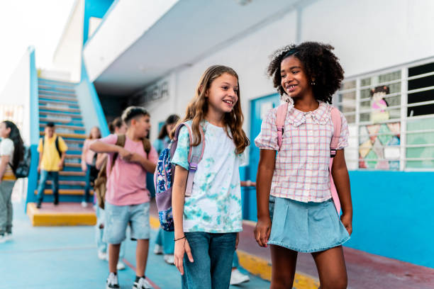istock Child student girls talking and walking on the school 2167904201