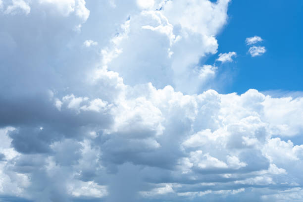 istock Bright blue sky with fluffy white clouds on a sunny day 2167905741
