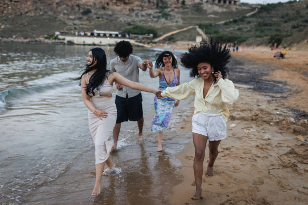 istock Joyful Young People Enjoying a Summer Day at the Beach 2167909774