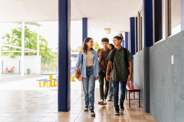 istock Teenage students talking and walking on the school 2167912366