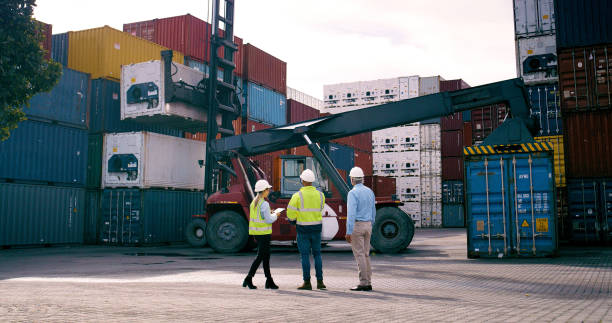 istock Container, crane and supervisor talking to staff at commercial dock for supply chain logistics. Conversation, management and shipping with team of people at harbor together for export or import 2167914069