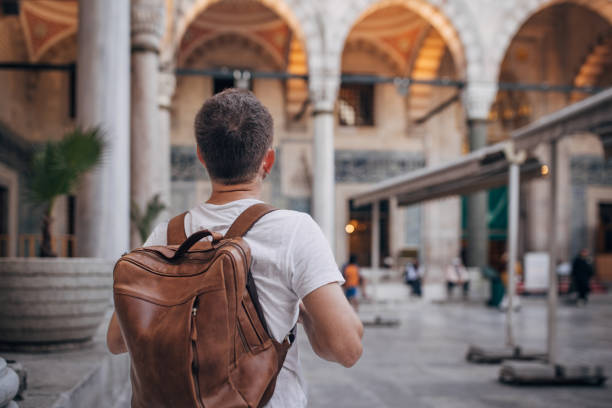 istock Tourist exploring the Suleymaniye Mosque with a brown backpack 2167914284