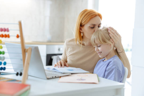 istock Mother helping her cute daughter with homework 2167914953