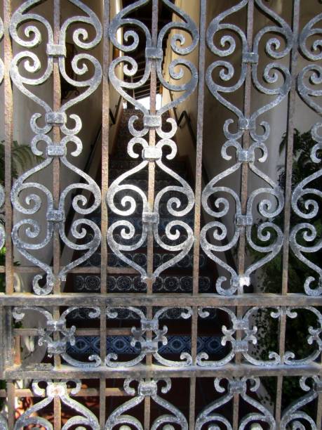 istock Staircase between buildings and behind cast iron gate 2167916743