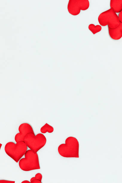 istock Red textile hearts confetti on a blue background. 2167917886