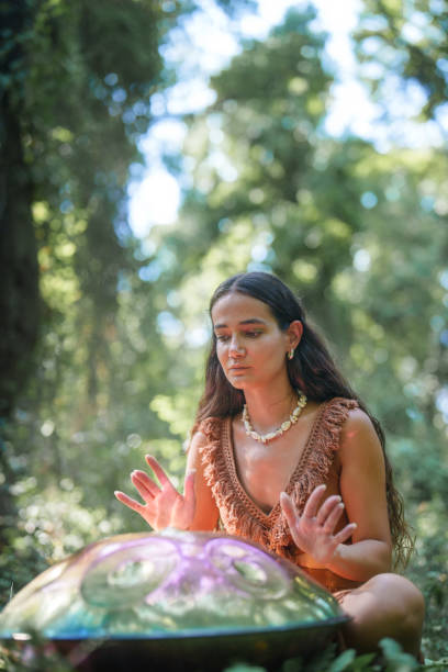 istock Environmentalist woman playing handpan in forest 2167917966