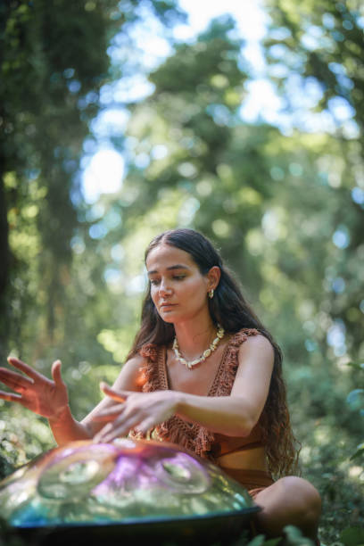 istock Environmentalist woman playing handpan in forest 2167917973