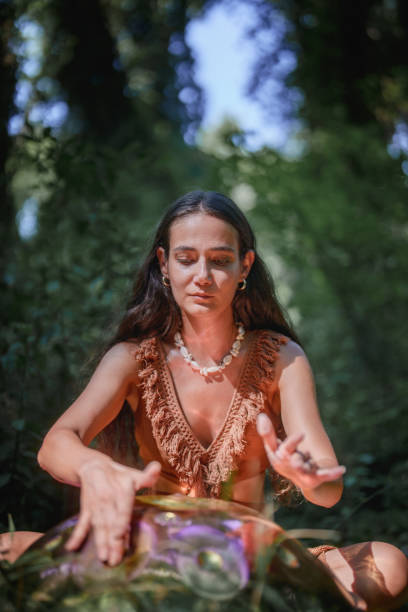 istock Environmentalist woman playing handpan in forest 2167918591