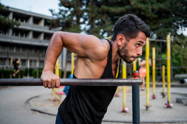 istock Man training in an outdoor gym 2167920017