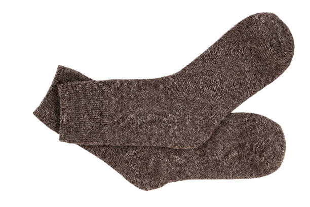 istock knitted warm wool socks, insulated on a white background 2167920275
