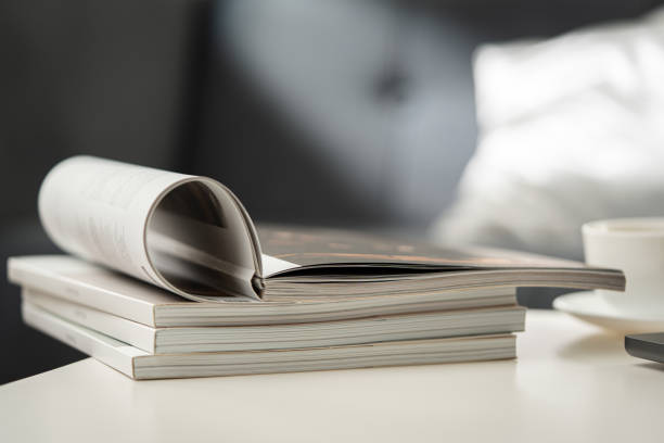 Stack of Magazines on White End Table in Living Room
