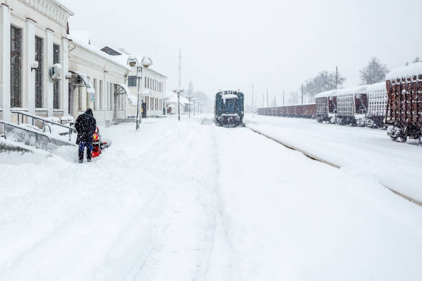 Railway station platform during heavy snowfall. Railway station in winter during snowfall