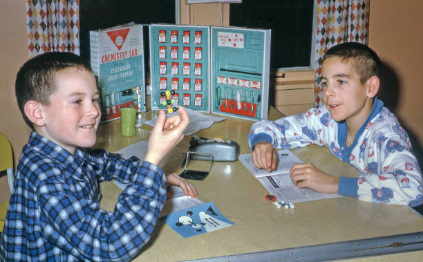 istock two brothers playing with chemistry set 1961 2167922043