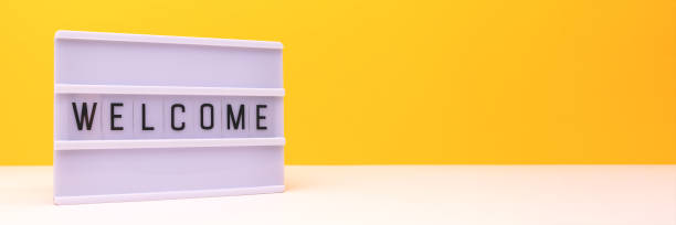 istock Word Welcome. Banner with lightbox in front of yellow background. 2167922383