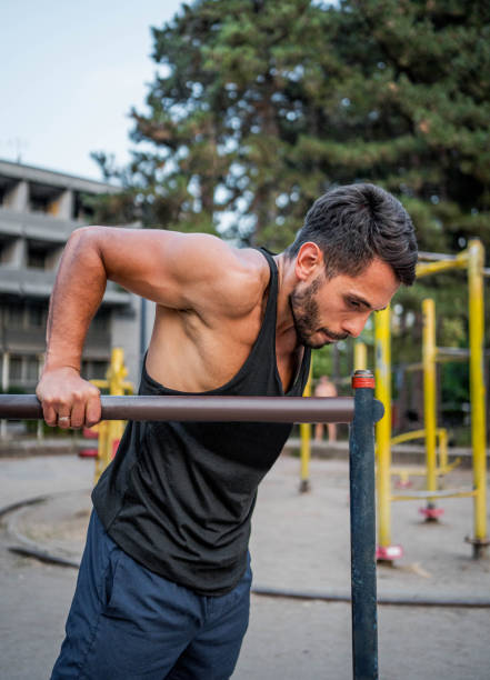 istock Man training in an outdoor gym 2167923135