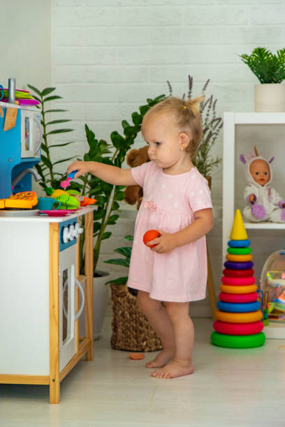 istock little girl is playing with toys. Selective focus 2167924233