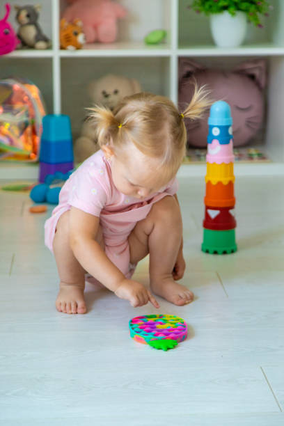 istock little girl is playing with toys. Selective focus 2167924241