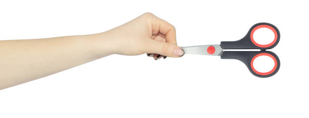 istock stationery scissors in hand, outstretched hand with scissors isolated from background 2167932202