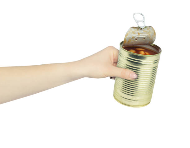 istock open tin can in hand, outstretched hand with tin can isolated from background 2167932236
