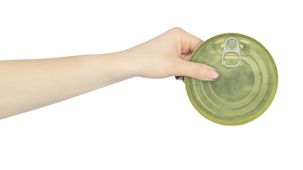 istock Tin can in hand, outstretched hand with Tin can isolated from background 2167932256
