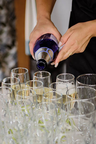 istock Waiter pours champagne into the glasses 2167932596
