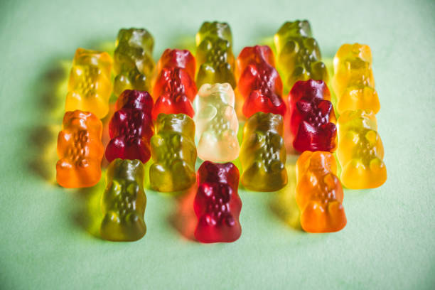 istock colorfull gummy bears on green background 2167935903