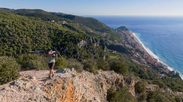 istock Mountain biker carries bikes over rocky terrain 2167935918