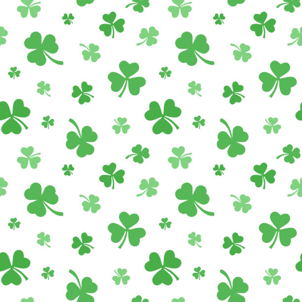Seamless pattern of green clover leaves isolated on white background for Saint Patrick's Day. Seamless pattern with green leaves on white background for printing on textile or wrapping papper. pics for shamrocks to print stock illustrations