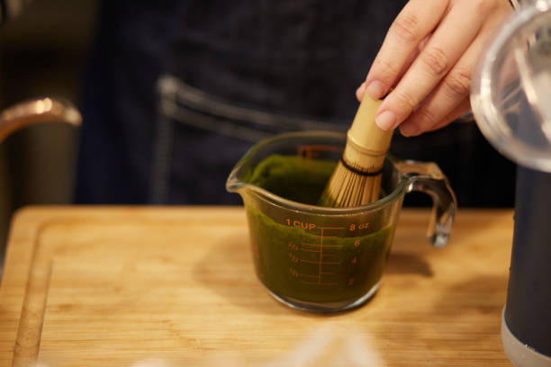 istock Making matcha latte in a coffee shop, close-up view 2167937722