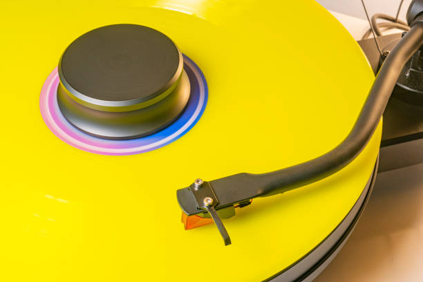 Collectable limited edition coloured long playing album on the turntable of an analogue stereo record player