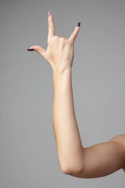 istock Woman's Hand Making Rock And Roll Sign With Black Nail Polish 2167939227